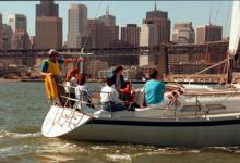 The captain keeps watch as the crew is at the helm